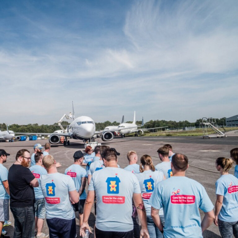 Boeing 737 being pulled in charity event at Bournemouth Airport
