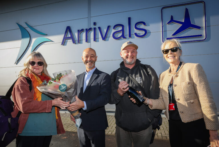 Bournemouth Airport surprises its one millionth passenger this year with champagne and flowers