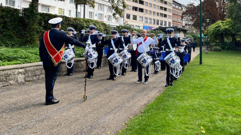Sir Ed Davey arrives with a marching band