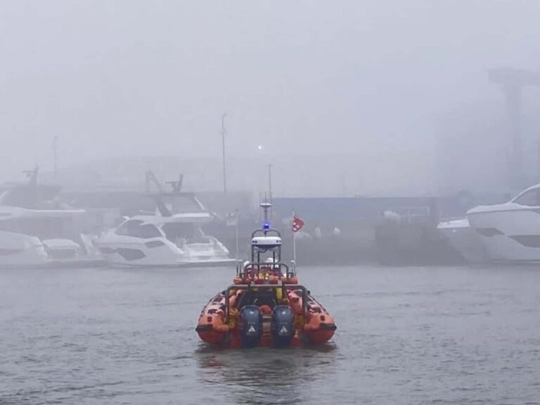 Poole lifeboat rescues three people and two dogs
