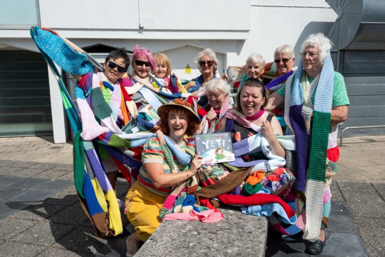 Poole knitters create giant stage scarf